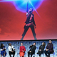 The cast of The Last Jedi sit together onstage.